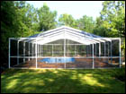 White, Free-Standing, Gable-Hip Style Pool Enclosure